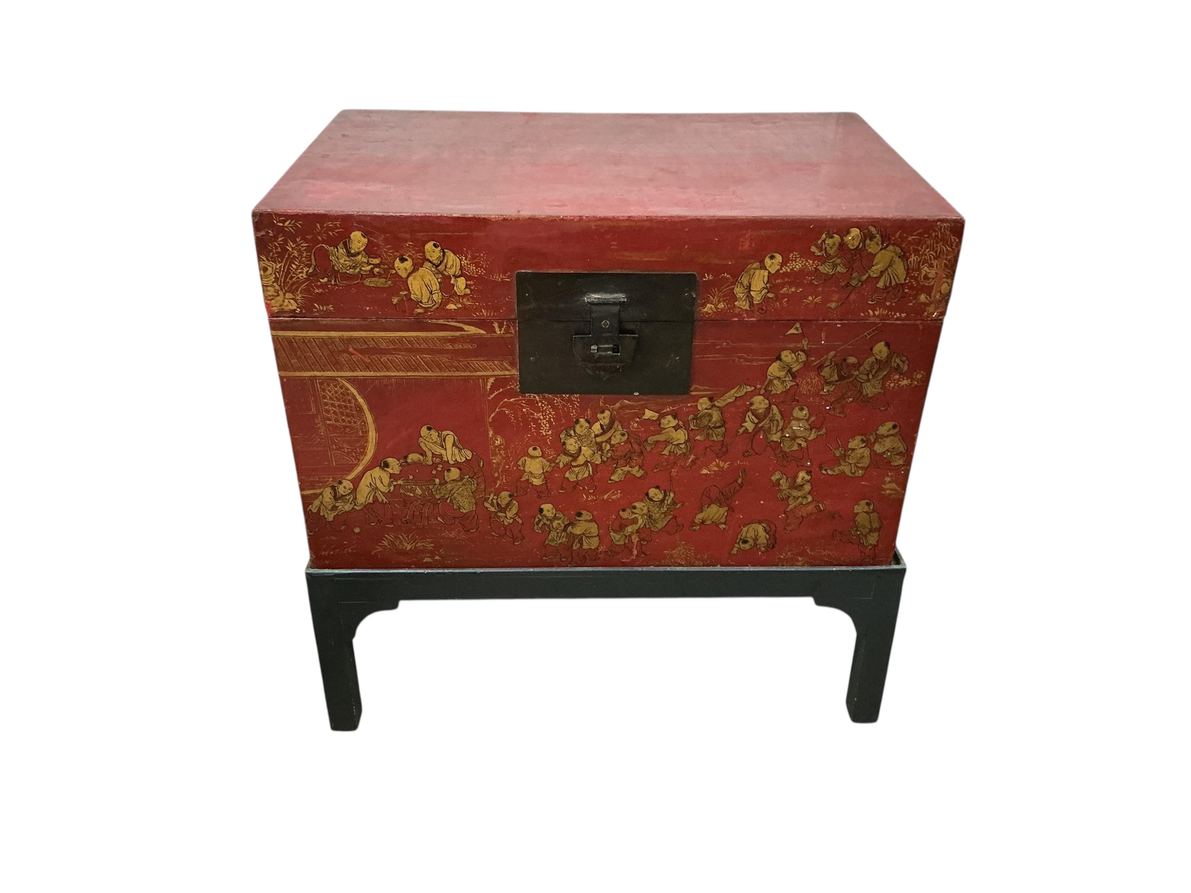 A Chinese scarlet lacquer trunk on stand, width 83cm, depth 53cm, height 84cm